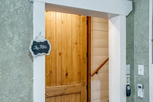 a hallway with a wooden door in a house at The Gallery House Boutique Hotel in Stephenville
