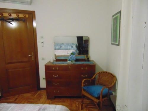 a bedroom with a dresser and a mirror at Podere Luma Camera Roseto - Mimosa in Gambassi Terme
