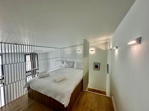 a bedroom with a large bed with a metal headboard at Hotel Krebuli in Kazbegi