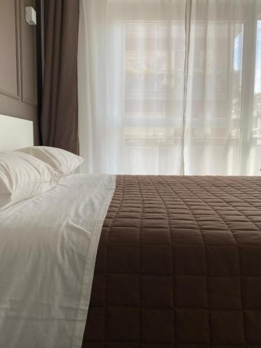 Postel nebo postele na pokoji v ubytování Quintino Sella rooms