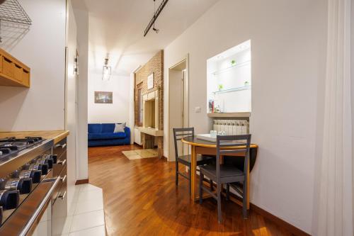 a kitchen with a table and chairs in a room at Casa Nostrana in Chioggia