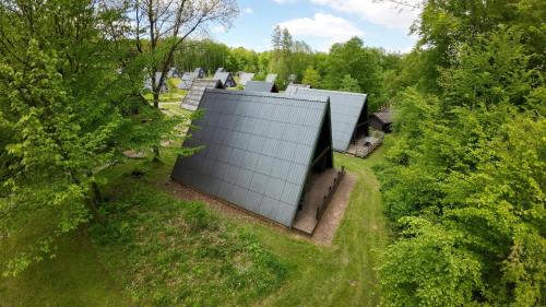 an overhead view of a building in the trees at Ferienhaus Ida am Twistesee in Bad Arolsen