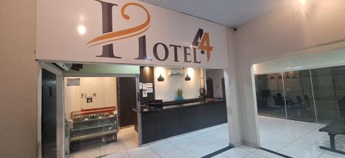 a store front with a a hotel sign on it at Shopping 44 Hotel in Goiânia