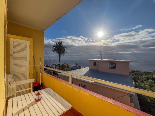 a balcony of a house with a view of the sun at Lightbooking Luymar con piscina Villa de Mazo in Villa de Mazo