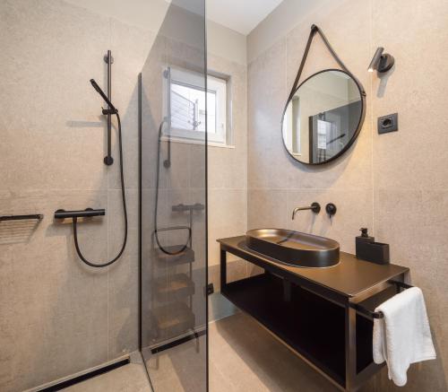 a bathroom with a sink and a shower at ZK luxury Villa in Murter