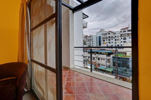 a balcony with a view of a city at Astra Hotels & Suites - Marathalli in Bengaluru