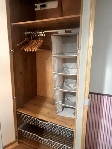 a cupboard filled with lots of shelves andngthngthngthngthngth at Hostal La Lluna in Arenys de Mar