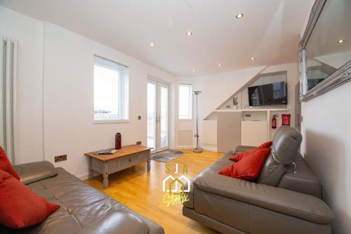 a living room with a couch and a table at Affleck Retreat 3 - SJA Stays - Modern 1 Bed Apartment in Aberdeen