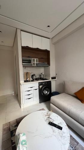 a living room with a couch and a table at home garden in Casablanca