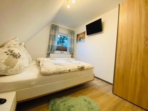 Ένα ή περισσότερα κρεβάτια σε δωμάτιο στο Ferienhaus Irmgard