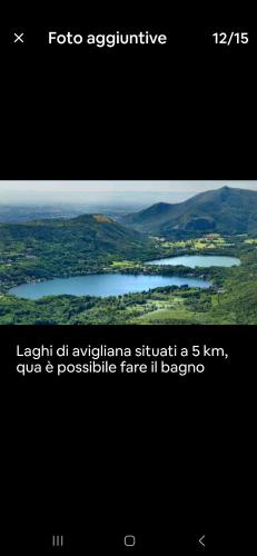 a screenshot of a webpage with a picture of a lake at borgo romantico in Villar Dora