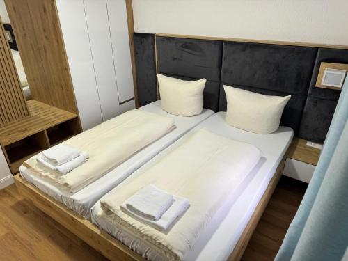 a bedroom with a bed with two towels on it at Ferienhaus in Soltau in Soltau
