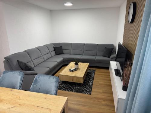 a living room with a couch and a table at Ferienhaus in Soltau in Soltau