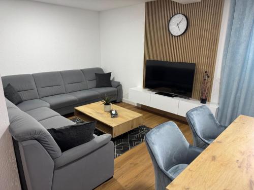 a living room with a couch and a tv at Ferienhaus in Soltau in Soltau