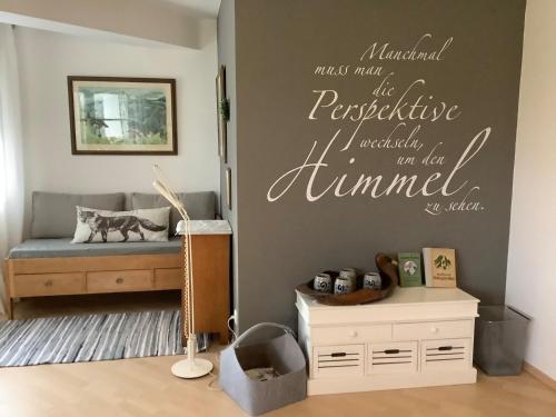 a childs room with a bed and words on the wall at Hanni und Nanni in Haldenwang