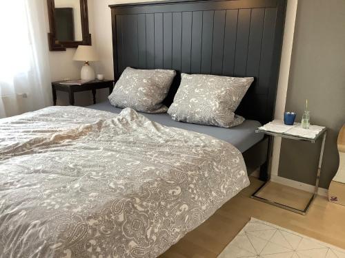 a bedroom with a bed and two pillows on it at Hanni und Nanni in Haldenwang
