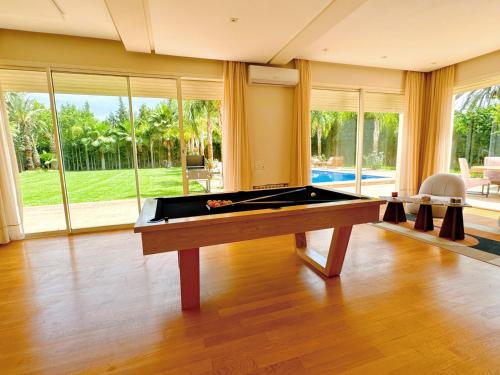 a large room with a pool table in a house at Villa Marrakech, 15 min from center, Disco, Hammam in Marrakesh