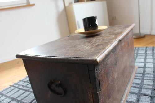 a wooden chest with a hat on top of it at Apartment Angelina in Bitz