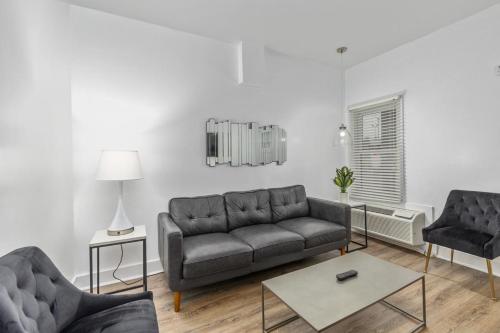 a living room with a couch and two chairs at Blue Star Motel in Douglas