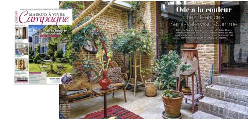 a magazine cover of a garden with potted plants at Purple House in Saint-Valery-sur-Somme