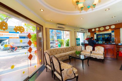 a waiting room with couches and a table in a store at Hoang Ha Boutique Hotel in Ho Chi Minh City