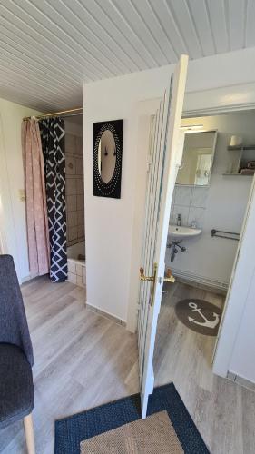 an open door to a room with a bathroom at Appartement Nummer 26 in Kappeln