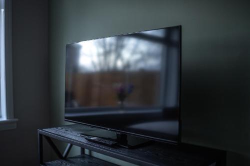 a large flat screen tv sitting on a table at Bank House in Livingston