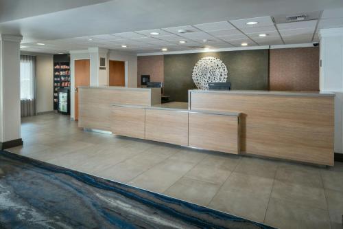 a lobby with a reception desk in a building at Fairfield Inn & Suites by Marriott Anchorage Midtown in Anchorage