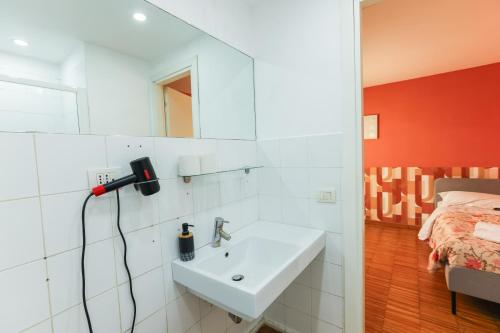a bathroom with a sink and a bed at casa dolce casa in Rome