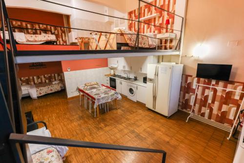 a small room with a table and a refrigerator at casa dolce casa in Rome