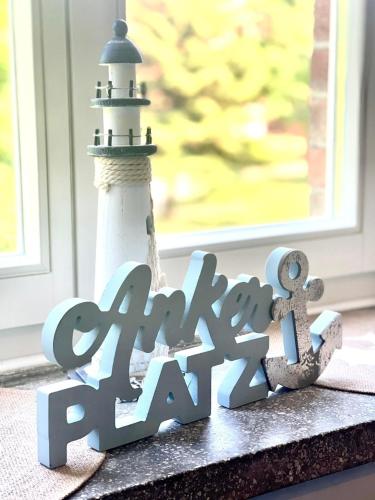 a sign for a party rate next to a lighthouse at Gästehaus Sternschanze - App 4 &bdquoObermaat&ldquo in Stralsund