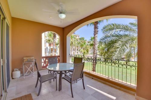 a dining room with a table and chairs and a large window at Colorful Paraiso del Mar Resort Condo with Patio! in La Paz