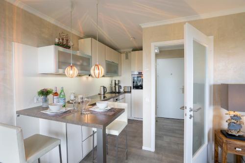 a kitchen with a table in a room at Apartment Plön Seeblick in Plön