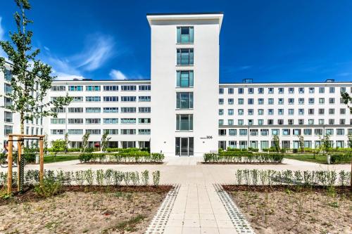 an office building with a large white building at Loft Lori in Buhlitz