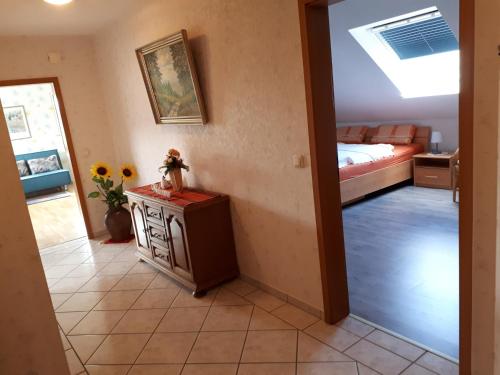 a room with a room with a bed and a table at Ferienwohnung-Lilienweg in Hilter am Teutoburger Wald
