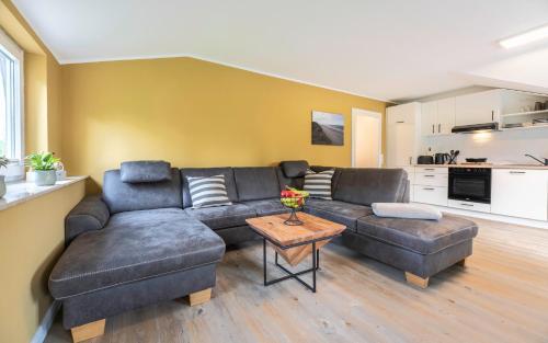 a living room with a couch and a table at Franzi in Weesby