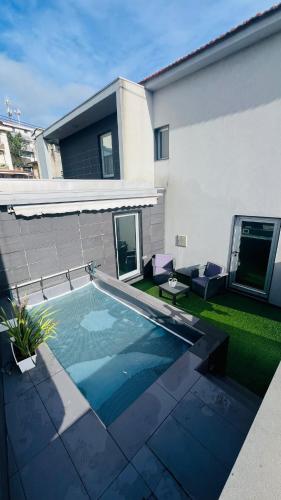 a swimming pool in the backyard of a house at NocasHouse Porto - Portugal, Campo, Valongo in Campo