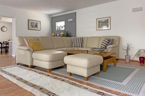 a living room with a couch and a table at Lieselhaus in Busenberg