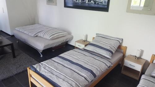 Ένα ή περισσότερα κρεβάτια σε δωμάτιο στο Guest RooM