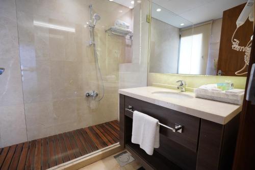 a bathroom with a sink and a shower at Heaven Prestige Hotel in Jounieh