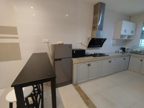 Η κουζίνα ή μικρή κουζίνα στο Empire Citystay at Moyan-4Queen