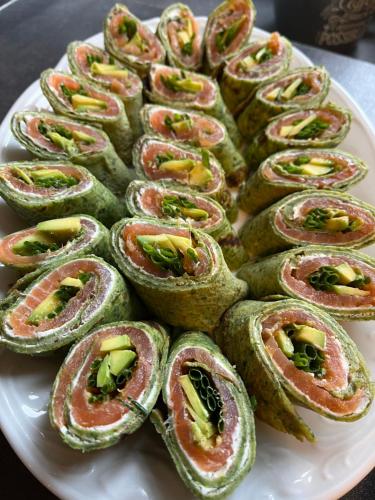 a white plate with a bunch of rolled up food at Tawerna Pod Kotwicą pokoje i domy wakacyjne in Kadłub Wolny