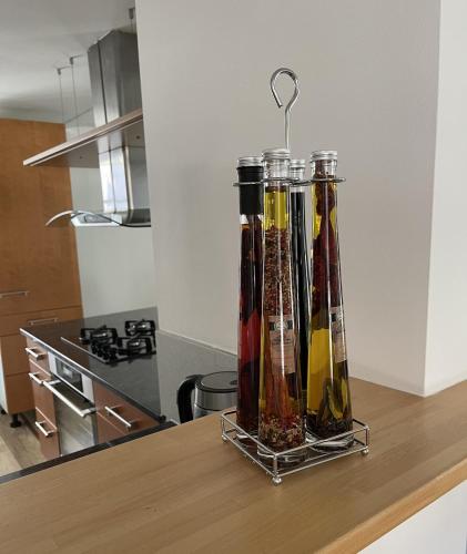 a group of bottles on a counter in a kitchen at Grosse Neue Wohnung in Bern mit Whirlpool in Bern