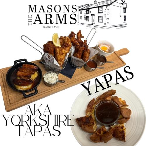 a plate of food with wings and a plate of food at Masons Arms in Skipton