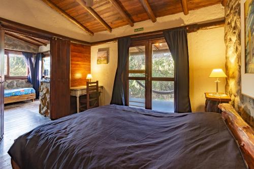 Una cama o camas en una habitación de ASM CABAÑAS XIII