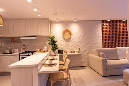 a kitchen and living room with a table and chairs at Apto Nanto in Mucugê