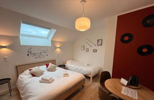 Cama o camas de una habitación en SensUP à 5min de Pairi Daiza