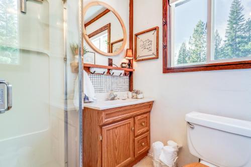 a bathroom with a sink and a mirror at Serene Lakes Cabin with Deck Dog Friendly! in Soda Springs