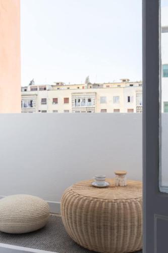 a room with a round table and a window at Bohème in Tunis