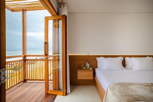 Postel nebo postele na pokoji v ubytování Casa na Areia Preá Ceará